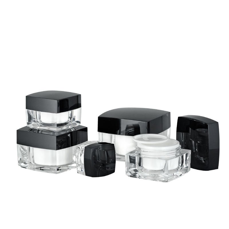 Cosmetic packaging containers and components on a white background.