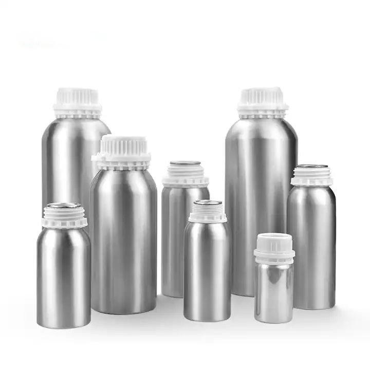 Glass and metal packaging containers on a white background.