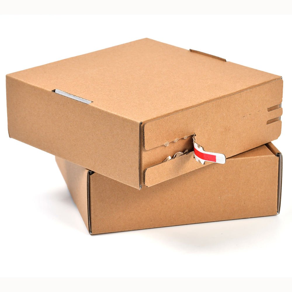 Mailing and shipping supplies including mailers, tape and labels on a white background.